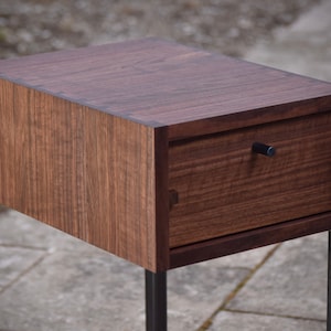 Sideways minimalist end table with drawer, pictured in walnut