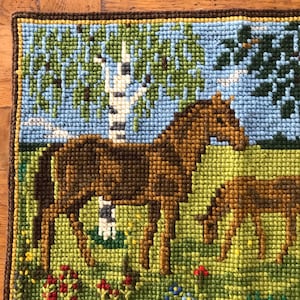 vintage chunky cross stitch panel depicting horses trees flowers wool on cotton wall hanging