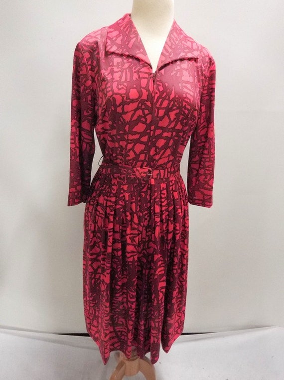 Vintage ladies red shirtwaist dress with belt.1950