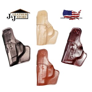 May include: Four leather holsters in different colors: black, tan, brown, and reddish-brown. Each holster has the text "J&J" embossed on the side. The holsters are hand-crafted in the USA.