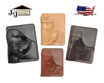 May include: Four leather gun holsters in different colors: black, brown, tan, and dark brown. Each holster has a pocket for a gun and a J&J logo embossed on the front. The holsters are hand-crafted in the USA.