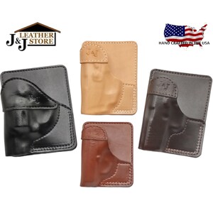 May include: Four leather wallets in black, tan, brown, and dark brown. Each wallet has a holster design and the initials "J&J" embossed on the flap. The wallets are hand crafted in the USA.