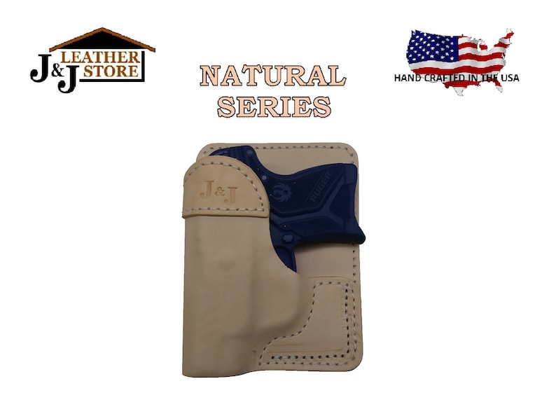 May include: A tan leather holster for a small, black handgun. The holster has a stitched design and the text "J&J" is embossed on the front. The text "NATURAL SERIES" is printed above the holster. The text "HAND CRAFTED IN THE USA" is printed below a small American flag.
