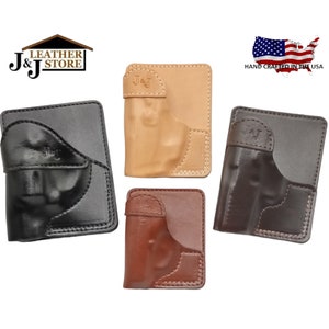 May include: Four leather gun holsters in different colors: black, brown, tan, and dark brown. Each holster has a pocket for a gun and a J&J logo embossed on the front. The holsters are hand-crafted in the USA.