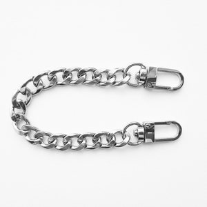 Correa de muñeca lateral, correa de bolso, correa de cadena, correa de metal gancho de pestillo, correa de muñeca gris mosquetón de metal, correa de pulsera, correa de cadena