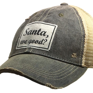 May include: A distressed black and tan trucker hat with a white patch that reads "Santa, we good?"