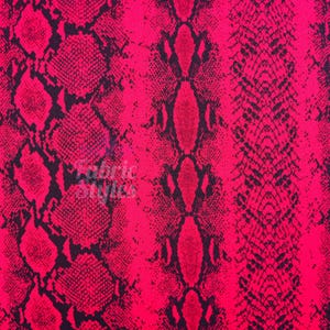 May include: A vibrant hot pink fabric featuring a repeating black snakeskin pattern. The design displays vertical bands of varying scale, with larger diamond-shaped scales on the left and finer, more intricate textures on the right. The text Fabric Styles is visible.