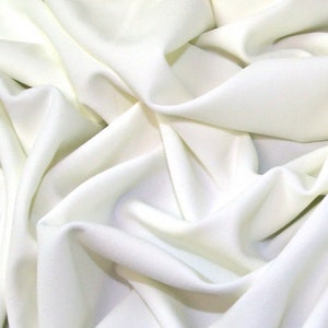 FS134_10 Tejido de punto elástico de crepé de buceo de alta calidad en color marfil liso para confección de vestidos. Se vende por metro.