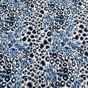 May include: A fabric with a repeating pattern of blue and gray leopard spots and vertical stripes on a white background. The spots vary in size and shade, creating a textured appearance. The design is suitable for apparel or home decor.