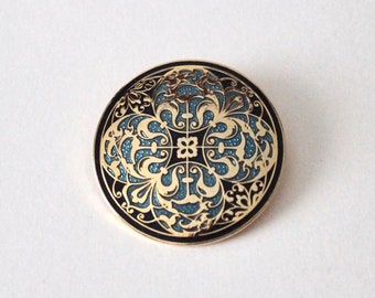 Vintage Sea Gems Celtic round black blue enamel gold tone brooch. Filigree quatrefoil gold ornate hard enamel signed Celtic Sea Gems brooch.