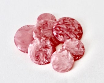 Vintage pearlised marbled pink mixed size buttons. Various size mixed bubble gum pink pearlised buttons. 7 candy pink buttons in 3 sizes.