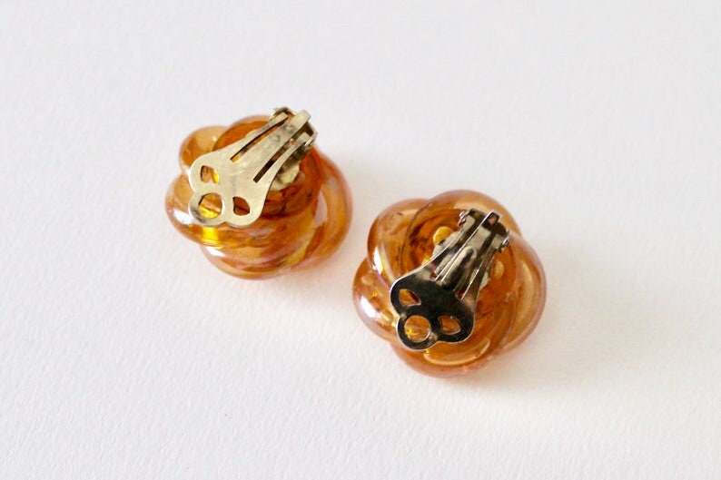 1950/'s twist knot statement orange rainbow coated tubular knot clip on earrings. Vintage orange rainbow lustre knot clip on earrings