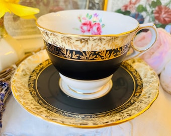 Royal Stafford Black and Gold Teacup and Saucer with Pink Flowers