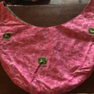 May include: Pink paisley patterned tote bag with a green John Deere logo.