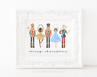 May include: A white framed print with a watercolor illustration of the Nutcracker characters. The characters are a Nutcracker soldier, a ballerina, a mouse king, and a princess. The text "merry christmas" is written below the characters.