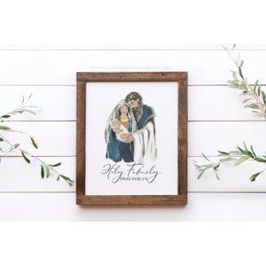 May include: A watercolor painting of the Holy Family. Mary, Joseph, and baby Jesus are depicted in a loving embrace. The text below reads "Holy Family. Pray for Us."