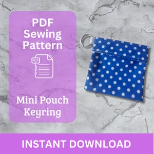 May include: PDF sewing pattern for a mini pouch keyring. The pattern is for a small blue pouch with white polka dots and a silver key ring.