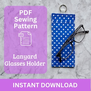 May include: A PDF sewing pattern for a lanyard glasses holder. The pattern is for a blue and white polka dot fabric. The image also shows a pair of glasses in the holder.