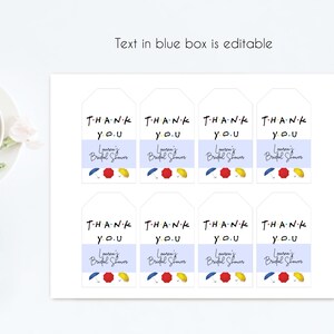 May include: Eight white gift tags with the text "THANK YOU" in colorful letters, a blue and white striped background, and the words "Lauren's Bridal Shower" in black script. The tags feature a red, yellow, and blue umbrella design.