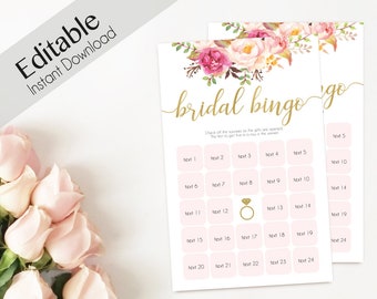 May include: Printable bridal bingo game with a pink floral design. The game has 25 squares with text prompts. The text at the top says "bridal bingo go".