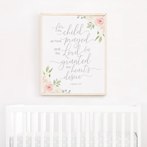 May include: A framed print with a floral design and the text "For this child we have prayed and the Lord has granted our heart's desire. 1 Samuel 1:27"
