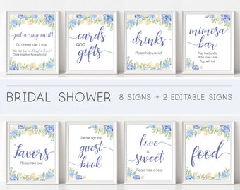 May include: Eight printable bridal shower signs with blue and yellow floral designs. The signs include the text: "put a ring on it!", "cards and gifts", "drinks", "mimosa bar", "favors", "guest book", "love is sweet", and "food".