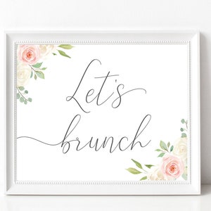 May include: White printable sign with a floral border and the text "Let's brunch" in black cursive font.