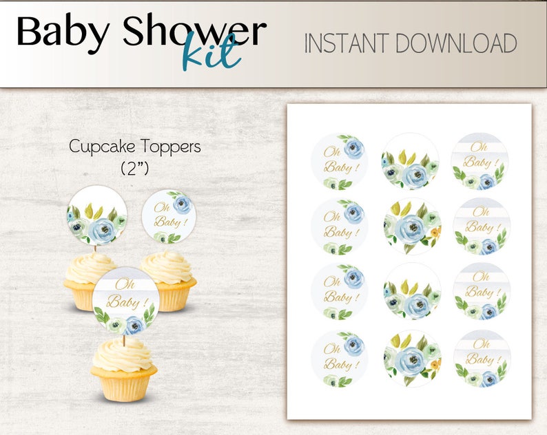 May include: A set of 12 blue and white cupcake toppers with gold lettering that says "Oh Baby!" The toppers are 2 inches in diameter and feature a watercolor floral design.