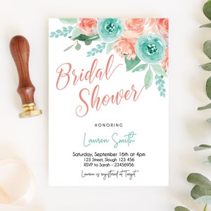 May include: A white bridal shower invitation with a watercolor floral design in shades of pink and blue. The text reads "Bridal Shower" in pink script and "Honoring Lauren Smith" in blue script. The invitation includes the date, time, location, RSVP information, and the registry location.