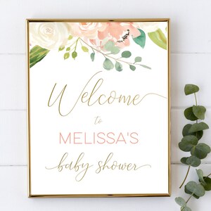 Puede incluir: Un cartel blanco con marco dorado y dise&ntilde;o floral. El cartel dice "Bienvenido al baby shower de Melissa".