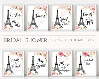 Könnte beinhalten: Acht druckbare Schilder mit einem schwarzen Eiffelturm mit rosa floralen Akzenten. Die Schilder enthalten den Text "Wishes for the Mr & Mrs", "Favors Thank You", "Please Sign Guest Book", "Cards & Gifts", "Treats & French Kisses", "Bon Appetit", "Help the Bride to Be Please be the Addressee" und "Your Text Here".