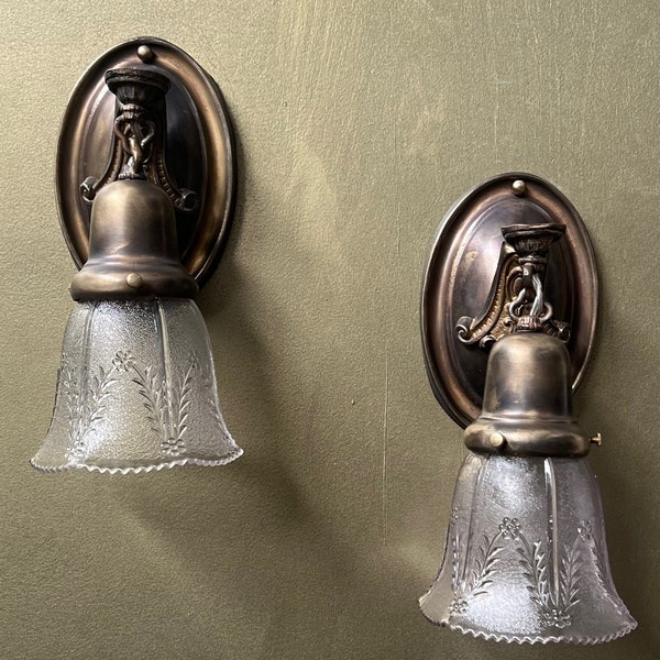 Pair of Antique Brass Wall Sconces with Pressed glass Shades.