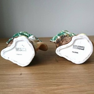 May include: Two ceramic figurines of woodland animals, a rabbit and a deer, with green and brown painted details. The bottom of each figurine has the text "Hornsea Made in England" and "Fauna".