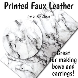 May include: A 6x12 inch sheet of white faux leather with a black marble print. Great for making bows and earrings.