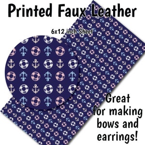 May include: A sheet of printed faux leather with a navy blue background and a repeating pattern of white anchors and pink and blue life preservers. The sheet measures 6x12 inches. The text "Great for making bows and earrings!" is printed on the sheet.