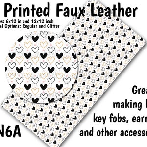 May include: Printed faux leather sheet with a repeating pattern of black and gold hearts on a white background. The sheet is available in two sizes: 6x12 inches and 12x12 inches. The text "NN6A" is in the lower left corner of the image. The text "Printed Faux Leather" is at the top of the image. The text "Sizes: 6x12 in and 12x12 inch" is below the text "Printed Faux Leather". The text "Material Options: Regular and Glitter" is below the text "Sizes: 6x12 in and 12x12 inch". The text "Great for making bows, key fobs, earrings, and other accessories!" is in the lower right corner of the image.