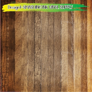 May include: A close-up of a woodgrain background with a yellow and green painted stripe across the top. The stripe has the text "Design | SMASHING INK VINYL SUPPLY" in black.