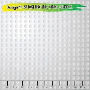 May include: White vinyl sheet with a textured golf ball pattern. The sheet is marked with a ruler in inches, showing a measurement of 11 inches.