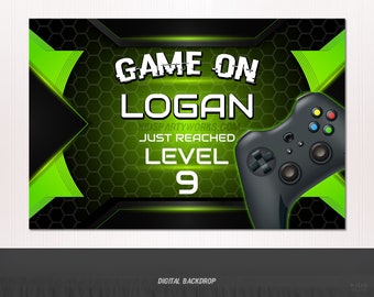 May include: A green and black digital backdrop with the text "GAME ON LOGAN JUST REACHED LEVEL 9" and a black video game controller.