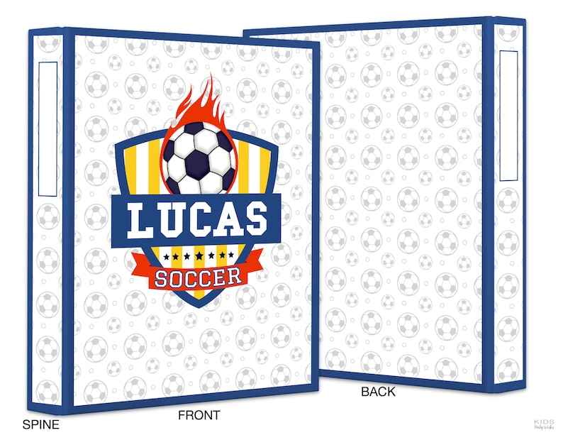 May include: A white binder with a blue border and a football-themed design. The front cover features a yellow and red shield with a football, flames, and the text "Lucas Soccer". The back cover has a white background with a repeating pattern of grey footballs.