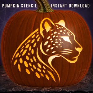 May include: A carved orange pumpkin featuring a glowing leopard head silhouette with distinct spots. The text PUMPKIN STENCIL INSTANT DOWNLOAD is visible at the top. The design shows the profile of a large cat with pointed ears and whiskers.