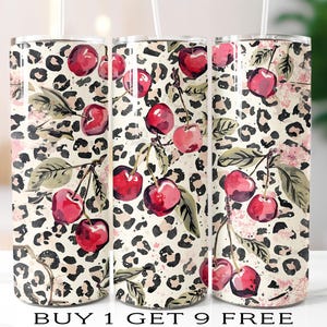 May include: Three stainless steel tumblers with a cherry and leopard print design. The tumblers feature a cream background with black leopard spots and watercolor cherries. The text "BUY 1 GET 9 FREE" is at the bottom.