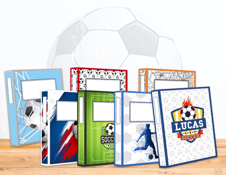May include: Six different designs of 1-inch binders with a football theme. The binders feature a variety of football-related designs, including a football, a football pitch, and a football player. The binders are all in different colours, including blue, red, green, and white.