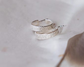 Hammer textured silver hoop earring