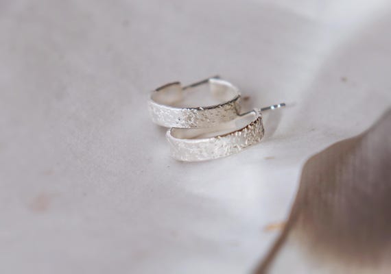 Hammer textured silver hoop earring