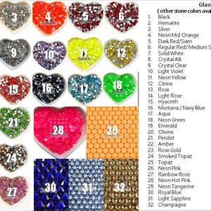 May include: Assortment of glass stones in various colors and shapes, including heart-shaped containers. Colors range from black to neon pink, with options like emerald, topaz, and champagne. Text lists available stone colors.
