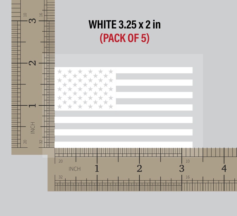 May include: A pack of five white 3.25 x 2 inch American flag decals. The decals are shown next to a ruler for size reference.