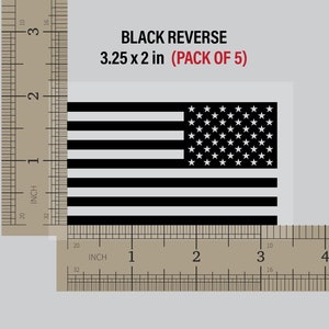 May include: A black and white American flag decal with 13 horizontal stripes and 50 white stars on a blue field. The decal measures 3.25 inches by 2 inches and is part of a pack of 5.