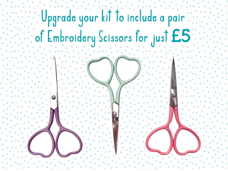 Text reads Upgrade your kit to include a pair of Embroidery Scissors for just £5. Below the text, three pairs of embroidery scissors with heart shaped handles in purple, mint green, and pink, shown on a white background with light blue polka dots.