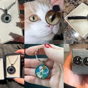 May include: A collection of jewelry and accessories, including necklaces with eye pendants, a keychain with a mermaid design, and cufflinks with gauge faces. The items are displayed in boxes, showcasing their presentation.